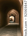 An adobe arch paved with rough stone in the ancient adobe city of Yazd. 92069847