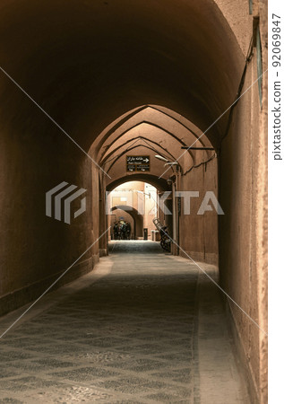 An adobe arch paved with rough stone in the ancient adobe city of Yazd. An adobe arch paved with rough stone in the ancient adobe city of Yazd. 92069847