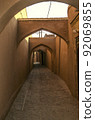 Narrow labyrinths of the ancient adobe city of Yazd with arched passages and roads paved with rough stone. 92069855