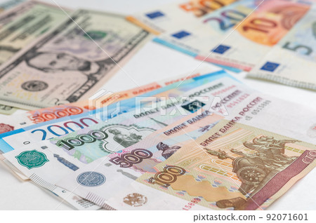 Money from different countries: dollars, euros, rubles. International currencies background. 92071601