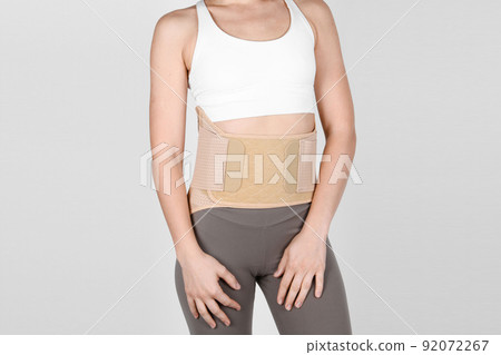 Orthopedic lumbar corset on the human body. Back brace, waist support belt for back. Posture Corrector For Back Clavicle Spine. Post-operative Hernia Pregnant and Postnatal Lumbar brace after surgery. Orthopedic lumbar corset on the human body. Back brace, waist support belt for back. Posture Corrector For Back Clavicle Spine. Post-operative Hernia Pregnant and Postnatal Lumbar brace after surgery. 92072267