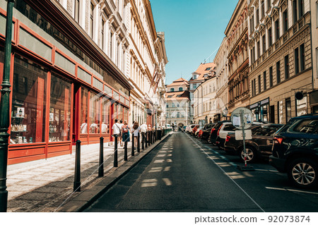 Beautiful cozy narrow street in old european city of Prague. Amazing architecture, historical Beautiful cozy narrow street in old european city of Prague. Amazing architecture, historical 92073874