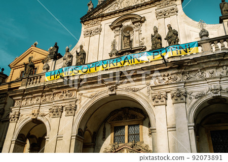 Church of St. Salvator with hands off Ukraine putin sign on facade in support. Historic complex Church of St. Salvator with hands off Ukraine putin sign on facade in support. Historic complex 92073891