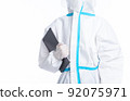 girl in a protective suit on a white background 92075971