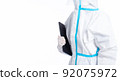 girl in a protective suit on a white background 92075972