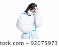 girl in a protective suit on a white background 92075973