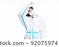 girl in a protective suit on a white background 92075974