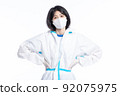 girl in a protective suit on a white background 92075975