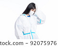 girl in a protective suit on a white background 92075976
