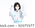 girl in a protective suit on a white background 92075977