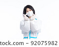 girl in a protective suit on a white background 92075982