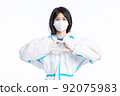 girl in a protective suit on a white background 92075983