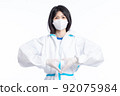 girl in a protective suit on a white background 92075984