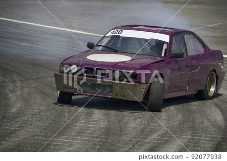 Unknown rider on the car overcomes the track. 92077938