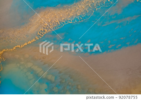 epoxy resin tray, marine-style stone cut. Blue stains of paint, gold trim. Abstract composition for your design. Fluid art. Natural luxury. The style includes swirls of marble or ripples of agate.  92078755