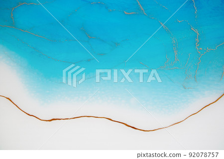 epoxy resin tray, marine-style stone cut. Blue stains of paint, gold trim. Abstract composition for your design. Fluid art. Natural luxury. The style includes swirls of marble or ripples of agate.  92078757