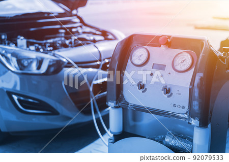 Car air conditioner ac repair service. Refill automobile ac compressor and checking auto conditioning system. Mechanic engine auto car service. Car air conditioner ac repair service. Refill automobile ac compressor and checking auto conditioning system. Mechanic engine auto car service. 92079533