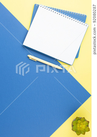 Spiral notepad with pen on top view table. Spiral notepad with pen on top view table. 92080287