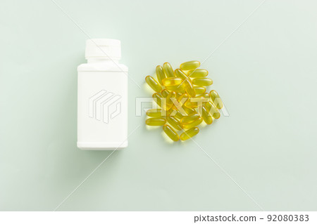 dietary supplements, Omega 3. omega 6. omega 9, capsules, oil, cod liver oil, vitamin A, vitamin D3, vitamin E, light, green, blue, background, top view, white container, case, bottle, copy space 92080383