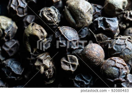 Background with whole black peppercorns 92080483