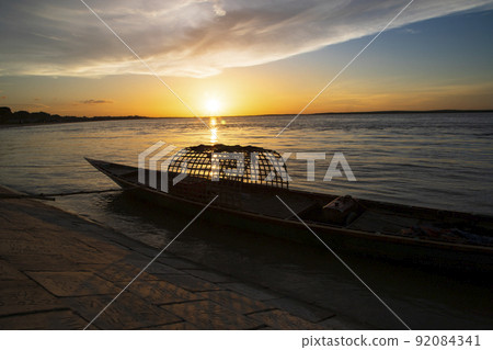 A wooden boat On Sea Against  Sky During Sunset  92084341