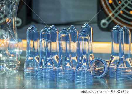 The close up scene of group of preform shape of PET bottle products. The close up scene of group of preform shape of PET bottle products. 92085812