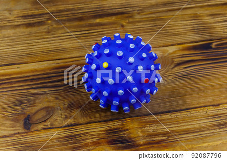 Blue dog toy ball on wooden background. Top view Blue dog toy ball on wooden background. Top view 92087796