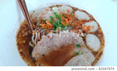 Thai food spicy tom yam noodle soup with pork Thai food spicy tom yam noodle soup with pork 92087974