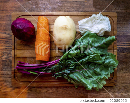 Board with ingredients for preparing tasty borscht on white background Board with ingredients for preparing tasty borscht on white background 92089933