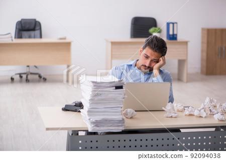 Young male employee rejecting new ideas in the office Young male employee rejecting new ideas in the office 92094038