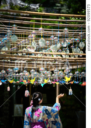 A cool wind chime and a woman in a kimono A cool wind chime and a woman in a kimono 92099573