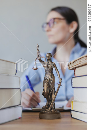 female lawyer works in the office, checking the contract and preparing documents for the court. legal advice online 92100657
