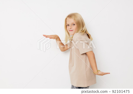 happy child with blond hair on a light background happy child with blond hair on a light background 92101475