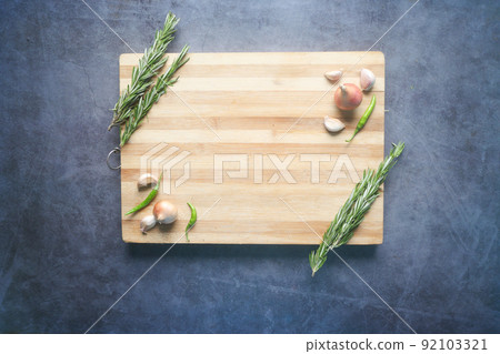 wooden chopping board on black background top down wooden chopping board on black background top down 92103321