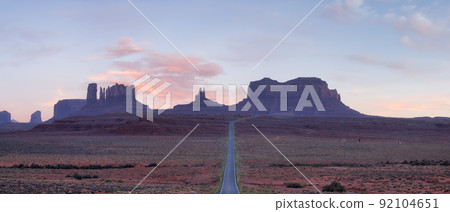 Scenic Road in the Dry Desert with Red Rocky Mountains in Background. Scenic Road in the Dry Desert with Red Rocky Mountains in Background. 92104651
