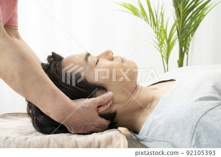 Men receiving massage Men receiving massage 92105393