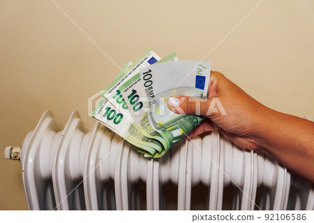 Home winter heating prices going up concept. 92106586
