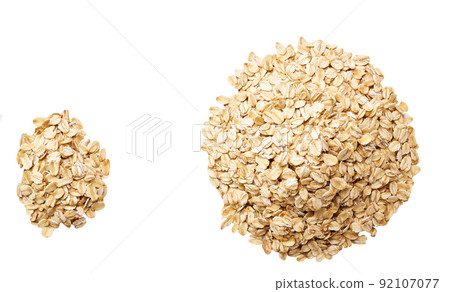 dry rolled oats isolated on white background top view. Pile oat flakes isolated on white background top view. 92107077
