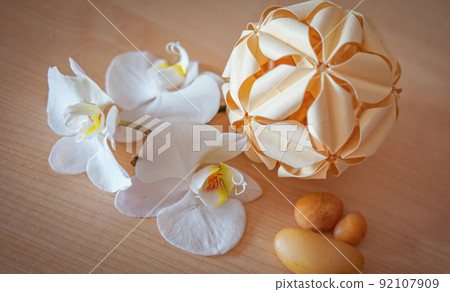large white orchid flowers on a brown background 92107909