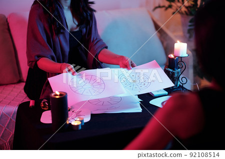 Astrologer Showing Natal Charts 92108514