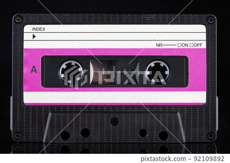 Red labeled retro vintage compact cassette A side on black 92109892