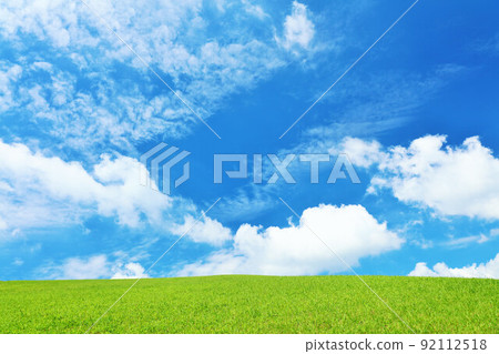 Refreshing blue sky and fresh green meadow landscape Refreshing blue sky and fresh green meadow landscape 92112518