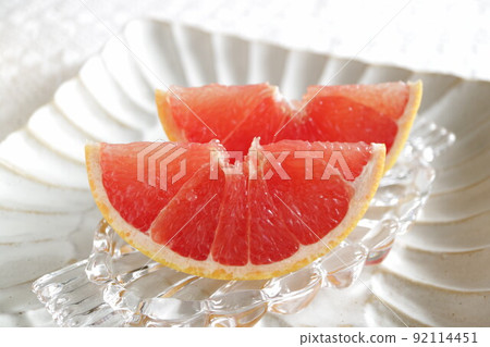 Grapefruit served on a glass plate Grapefruit served on a cool glass plate 92114451