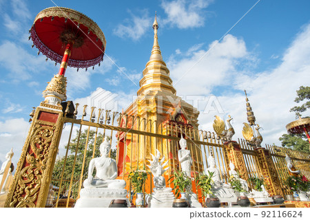 The golden pagoda of Wat Phra That Doi Wao located on the mountains peak in Mae Sai district nearly the border between Thailand and Myanmar. The temple is the perfect spot for border view. The golden pagoda of Wat Phra That Doi Wao located on the mountains peak in Mae Sai district nearly the border between Thailand and Myanmar. The temple is the perfect spot for border view. 92116624