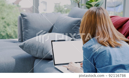 Empty Screen laptop Blogger Woman hands typing computer keyboard. Close up women hands using laptop sitting at sofa in living room. Freelance girl work from home office via internet call conference Empty Screen laptop Blogger Woman hands typing computer keyboard. Close up women hands using laptop sitting at sofa in living room. Freelance girl work from home office via internet call conference 92116786