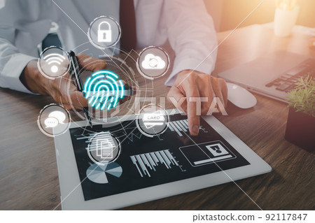 Business person hand using fingerprint indentification to access personal financial data, Fingerprint scan provides security access with biometrics identification. Business person hand using fingerprint indentification to access personal financial data, Fingerprint scan provides security access with biometrics identification. 92117847