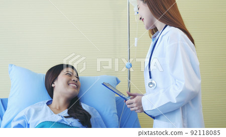 Woman doctor and patient consultation with professional specialist diagnostics at hospital medicare treatment clinic. Doctor talking to patient for medical health care therapy. Healthy medical concept Woman doctor and patient consultation with professional specialist diagnostics at hospital medicare treatment clinic. Doctor talking to patient for medical health care therapy. Healthy medical concept 92118085