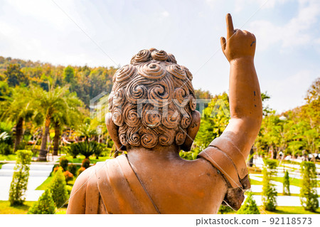 Little Buddha Bronze Copper statue points finger to the sky. Little Buddha Bronze Copper statue points finger to the sky. 92118573