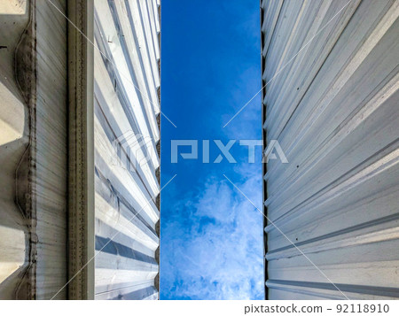 Metal sheet pattern with the blue sky in the middle. Metal sheet pattern with the blue sky in the middle. 92118910