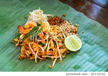 PadThai, The Traditional of Thailand Fried noodle with prawns on the banana leaf ready to serve for lunch. PadThai, The Traditional of Thailand Fried noodle with prawns on the banana leaf ready to serve for lunch. 92119142